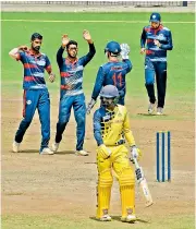  ?? — E.K. Sanjay ?? Jammu &amp; Kashmir players celebrate the wicket of B. Indrajith of Tamil Nadu in a Vijay Hazare match in Chennai on Sunday.