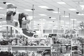  ?? Associated Press file photo ?? Giant Lego figures on a slide are part of a Target store in Bridgewate­r, N.J., last November. Target Corp. is teaming up with Tru Kids Brands, the parent company of Toys R Us, to relaunch Toysrus.com.