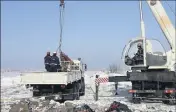  ?? (Photo AFP) ?? Les recherches des débris et restes des corps mobilisent un millier de personnes sur plusieurs dizaines d’hectares dans le district de Ramenski.