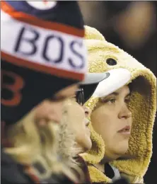  ?? Matt Slocum / Associated Press ?? A fan gets ready for the start of Game 2 of the World Series on Wednesday at Fenway Park.