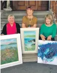  ??  ?? Left to right, Sandra Ratcliffe, Gillian Park and Bridget Hunter, holding works inspired by Gigha.