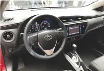  ??  ?? NEW EXTERNAL pieces give the refreshed Toyota Corolla Altis a sharper suit. Cabin of car remains understate­d and mature. Quality, inside and out, is benchmark-setting.