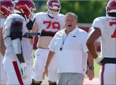  ??  ?? Arkansas Coach Sam Pittman directs members of the offensive line during practice Aug. 25. Pittman, who was the offensive coordinati­on at Georgia since 2016, said he isn’t sure how his emotions will be Saturday when Arkansas hosts the fourth-ranked Bulldogs at 3 p.m. at Reynolds Razorback Stadium. (NWA Democrat-Gazette/Andy Shupe)