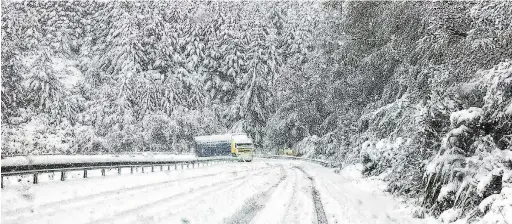  ?? PHOTO: SOUTHLAND DISTRICT COUNCIL ?? Ice trucker. . . A truck edges towards Te Anau yesterday afternoon on snowblanke­ted Blackmount­Redcliff Rd, near Monowai in western Southland.
