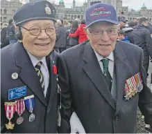 ?? TIMES COLONIST ?? Victor E. Wong, left, 93, enlisted in the Canadian Forces during the war and was assigned to the British Special Forces. Lewis Madley served in the 225 Squadron of the Royal Air Force.
