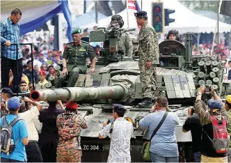  ??  ?? Tengku Mahkota Pahang Tengku Abdullah Sultan Ahmad Shah sitting atop an armoured vehicle which was part of the occasion in Kuantan.