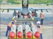  ?? AFP ?? Air Force soldiers prepare to load missiles in front of an F-16V fighter jet during a drill at Hualien Air Force base, in Taiwan.