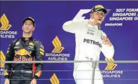  ?? AP ?? Mercedes driver Lewis Hamilton completed a hattrick of victories in Singapore.