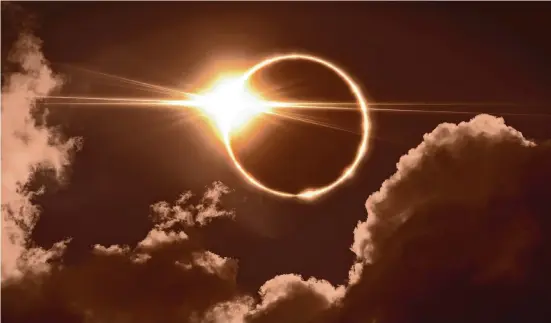  ?? Pitris/Getty Images / iStockphot­o ?? While “Look Up!” is written for younger readers, it contains informatio­n that educates everyone on how to enjoy the total eclipse of the sun.