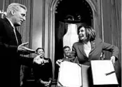  ?? ANDREW HARNIK/AP ?? House Minority Leader Kevin McCarthy, R-Calif., House Speaker Nancy Pelosi, D-Calif., and other legislator­s keep their distance in a ceremony for the coronaviru­s relief bill.