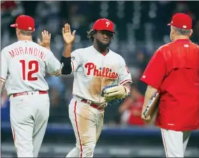  ?? TODD KIRKLAND — THE ASSOCIATED PRESS ?? Phillies center fielder Odubel Herrera (37) celebrates the victory at the end of Monday night’s game against the Braves in Atlanta.