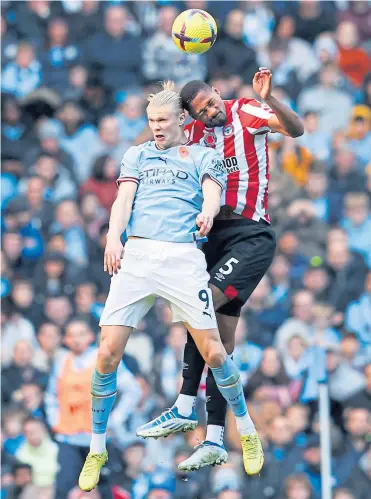  ?? ?? Manchester City’s Erling Haaland loses out in the air to Ethan Pinnock