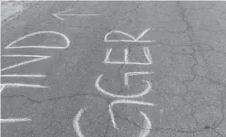  ?? Courtesy of Rouble Claire ?? The words “sand n **** r,” a racist slur used against people of Middle Eastern descent, were written in chalk outside of Rouble Claire’s house on May 11, 2021, in Sutter County.