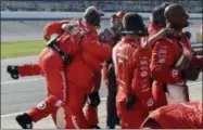  ?? CARLOS OSORIO — THE ASSOCIATED PRESS ?? Kyle Larson’s crew celebrate Kyle’s victory in the NASCAR Sprint Cup series auto race, Sunday in Brooklyn, Mich.