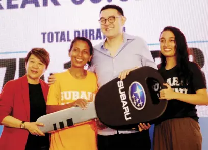  ??  ?? Singaporea­n Analiza Mokhtar (second from left) bested 399 other contestant­s to take home a brand-new Subaru and the title of 2018 Subaru Car Challenge champion. Here she is awarded by Subaru Motor Image officials led by Glenn Tan (third from left), deputy Chairman and managing director of Tan Chong Internatio­nal Ltd., parent company of Subaru distributo­r Motor Image.