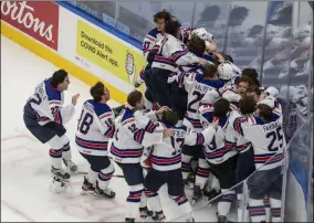  ?? JASON FRANSON - THE ASSOCIATED PRESS ?? U.S. players celebrate a win over Canada in the championsh­ip game in the IIHF World Junior Hockey Championsh­ip, Tuesday, Jan. 5, 2021, in Edmonton, Alberta.