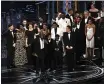  ?? CHRIS PIZZELLO — INVISION ?? Barry Jenkins and the cast and crew of “Moonlight” accepting the award for best picture at the Oscars in Los Angeles.