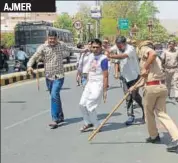  ?? HT PHOTO ?? Policemen round up a protester in Ajmer.