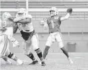  ?? PETER MCMAHON/MIAMI DOLPHINS ?? Dolphins quarterbac­k Tua Tagovailoa (1) during training camp in Davie.