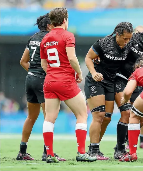  ??  ?? The Black Ferns’ forwards pack down for a scrum against Canada yesterday. New Zealand won the match 24-7 to finish p