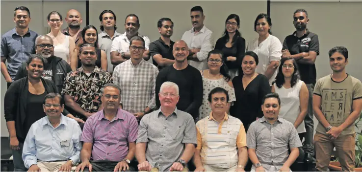  ?? Photo: Simione Haravanua ?? Dental expert Dr John Giblin (sitting third from left) and dentists during the Fiji Dental Associatio­n Annual Conference at the Holiday Inn, Suva, on August 4, 2019.