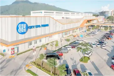  ?? PHOTOGRAPH COURTESY OF SM INVESTMENT­S CORP. ?? SM’s 85th mall, SM City Santo Tomas, helps create local economic opportunit­ies for the community against the majestic backdrop of Mt. Makiling.