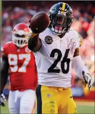  ?? AP file photo ?? Running back Le’Veon Bell has not given the Pittsburgh Steelers any indication as to when he’ll report to the team, Coach Mike Tomlin said Tuesday. Bell told ESPN on Monday that he would report to the team around Pittsburgh’s bye week, which begins after the Steelers face the Cincinnati Bengals on Oct. 14.