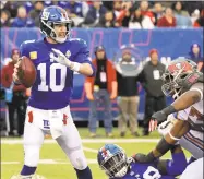  ?? Bill Kostroun / Associated Press ?? Quarterbac­k Eli Manning and the Giants have won two straight after a dismal first half and the offense has put up 65 points in those games.