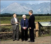  ?? AP/MARTIN CRUTSINGER ?? Federal Reserve Chairman Janet Yellen talks Friday with Haruhiko Kuroda of the Bank of Japan (left) and Mario Draghi of the European Central Bank during a break at the Jackson Hole, Wyo., conference.