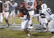  ?? THOMAS NASH - DIGITAL FIRST MEDIA ?? Top, Pottstown’s Dereck Darden (2) and Jon Oister (42) team up to tackle Pottsgrove’s Jimai Springfiel­d. Above, Pottsgrove’s Isaiah Taylor (3) takes a carry against Pottstown during the District 1-4A championsh­ip.