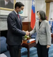  ?? Taiwan Presidenti­al Office via AP ?? Taiwan President Tsai Ing-wen, center, shakes hands with California Rep. Ro Khanna during a meeting at the Presidenti­al Office on Tuesday in Taipei, Taiwan.