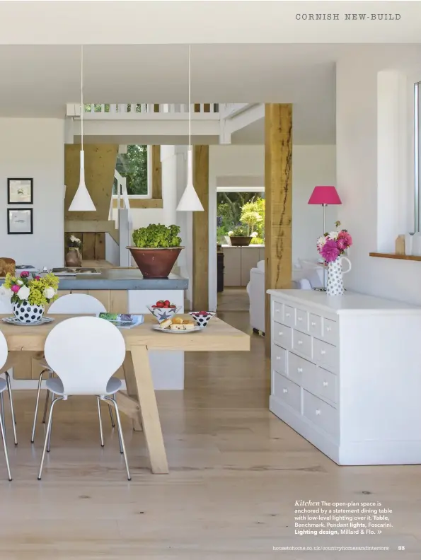  ??  ?? Kitchen The open-plan space is anchored by a statement dining table with low-level lighting over it. Table, Benchmark. Pendant lights, Foscarini. Lighting design, Millard & Flo.