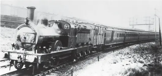  ??  ?? Having just departed Carlisle (Citadel) with a stopping service to Newcastle-upon-Tyne, NER ‘901’ class 2-4-0 No 1443 descends at 1 in 153 as the neighbouri­ng West Coast line climbs at 1 in 110, the stock seen above the NER train being London & North Western Railway. Edward Fletcher’s ‘1440s’ owed much to his earlier ‘901’ class and were built to serve on the Leeds-Ripon-West Hartlepool route, with the doyen rebuilt in Leeds from an 1849 locomotive and the others new from Gateshead. No 1443 dates from March 1877, was rebuilt with larger (18in bore) cylinders in August 1887 and received a Wilson Worsdell boiler (standard to eight classes) in May 1892. The view is undated but likely pre-World War I, but once the class was on lesser duties. The allocation is unknown, and Newcastle is likely, but other than a straight top-up of water, at this time any Newcastle & Carlisle main line servicing was undertaken at Carlisle’s NER shed at London Road. Sunderland-based at the end of 1920, No 1443 was one of nine ‘1440s’ to enter LNER service, its withdrawal coming in February 1925.