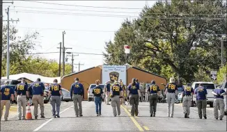  ?? JAY JANNER / AMERICAN-STATESMAN ?? FBI agents assist in the search for evidence on FM 539 after the Nov. 5 killing of more than 20 First Baptist Church parishione­rs in Sutherland Springs. “After the attack in Sutherland Springs, around 150 FBI employees were working on the case either...