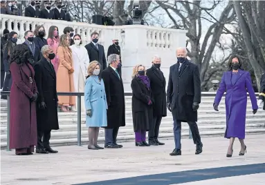  ?? EVAN VUCCI THE ASSOCIATED PRESS ?? TRIBUTE TO THE FALLEN: President Joe Biden and Vice-President Kamala Harris arrive at the Tomb of the Unknown Soldier at Arlington cemetery. Looking on are former president Barack Obama and his wife, Michelle, former president George W. Bush and his wife, Laura, and former president Bill Clinton and his wife, former secretary of state Hillary Clinton.