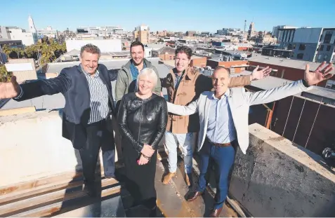  ?? Picture: ALAN BARBER ?? TOP SPOT: Bill Votsaris, Paul Votsaris, Cameron Hamilton, Eddy Kontelj and architect Tarryn Joyce atop the former Thomas Jewellers building, which will be overhauled with a range of hospitalit­y venues.