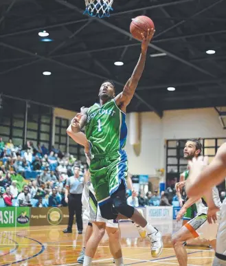  ?? Picture: SCOTT BELZNER ?? Gold Coast Rollers star Torrey Craig flies to the basket.