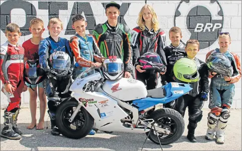  ??  ?? RACERS IN TRAINING: 2017 SA KTM390 champion Ricardo Otto, centre, with young riders participat­ing in the NSF developmen­t programme