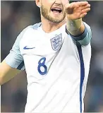  ??  ?? RIGHT SIGNALS England skipper Eric Dier shouts out the orders at Wembley last night