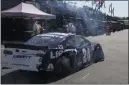  ?? CHARLES KRUPA — THE ASSOCIATED PRESS ?? With tires deflated and smoking after a crash, William Byron limps back to the garage during a NASCAR Cup Series auto race practice at New Hampshire Motor Speedway in Loudon, N.H., Saturday.