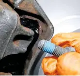  ??  ?? Some brake pad kits do not supply a replacemen­t lower bolt for sliding calipers. If reusing the removed bolt, apply some thread-lock compound before refitting it.