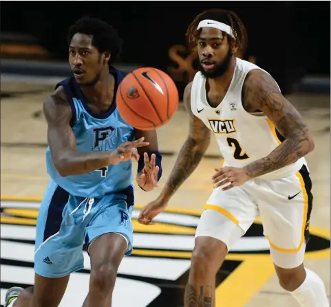  ?? Photos courtesy of VCU Athletics ?? In the first start of his Rhode Island career, Towson transfer Allen Betrand (4, above) produced 13 points and two assists to lead the Rams to an 83-68 A-10 road victory over VCU Saturday afternoon. Below, Malik Martin goes up for two of his five points.