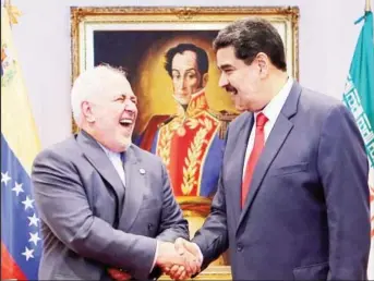  ?? ?? Venezuelan President Nicholas Maduro with Iran oil minister*