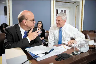  ?? AP/J. SCOTT APPLEWHITE ?? U.S. Rep. James McGovern, D-Mass (left), the top Democrat on the House Rules Committee, confers Wednesday with committee chairman Pete Sessions, R-Texas, on Capitol Hill about amendments to the 2018 farm bill, which is scheduled for a House vote today.