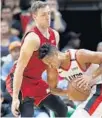  ?? WILFREDO LEE/AP ?? Heat guard Goran Dragic, left, defends the Trail Blazers’ C.J. McCollum during the first half Saturday night.