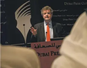  ??  ?? Former Gulf News editor Francis Matthew speaks at Dubai Press Club in 2009. Right, Jane Matthew Amy Leang / The National; Peter Manning