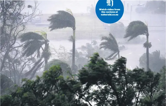  ?? Pictures / AAP ?? Watch video from the cyclone at nzherald.co.nz Cyclone Debbie blasted the mainland from about 12.40pm local time, breaking windows, shaking buildings and sending sheets of metal flying.