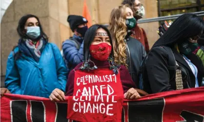  ?? Photograph: Peter Summers/Getty Images ?? An indigenous Amazonian woman protests with Extinction Rebellion in Glasgow.