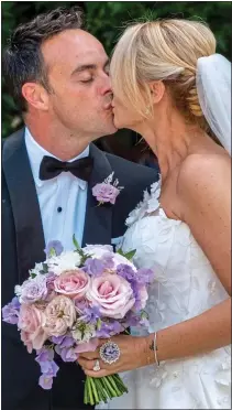  ??  ?? MR AND MRS: The newlyweds wave to fans yesterday, left, and share their first kiss as man and wife, above