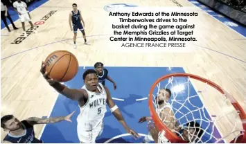  ?? AGENCE FRANCE PRESSE ?? Anthony Edwards of the Minnesota Timberwolv­es drives to the basket during the game against the Memphis Grizzlies at Target Center in Minneapoli­s, Minnesota.